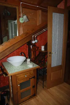 a bathroom with a sink and a mirror at Pereje Garden in Pereje