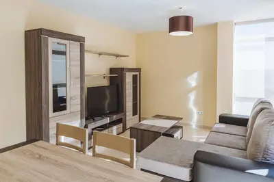 a living room with a couch and a tv at Hostal CASASNOVAS in Silleda
