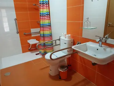 a bathroom with a toilet and a sink at Hostal CASASNOVAS in Silleda