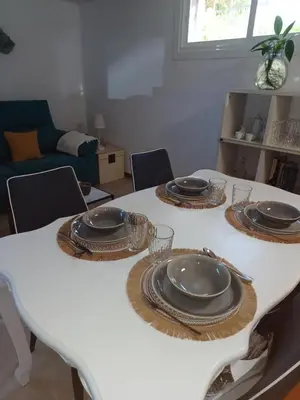 a white table with plates and dishes on it at Casa Raposeira in Ourense