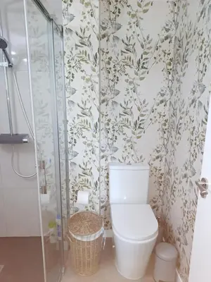 a bathroom with a toilet and a shower at Casa Raposeira in Ourense