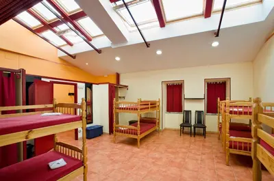 a dorm room with bunk beds in it at Albergue Vía Láctea in Arzúa