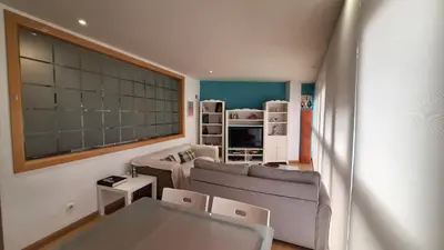 a living room with a couch and a table at Dúplex Plaza Saco y Arce in Ourense
