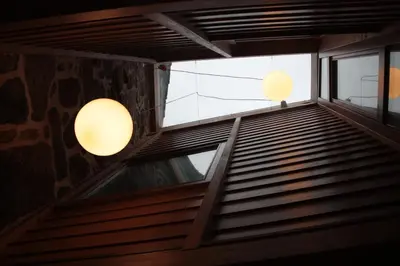 an escalator in a building with two lights at Casa Manuela in Allariz