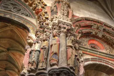 a group of statues on the side of a building at Casa Manuela in Allariz