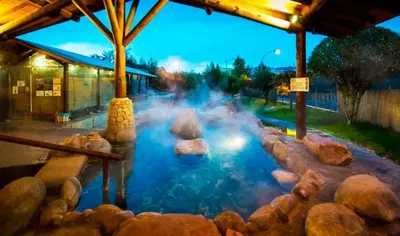 a large pool of water with rocks in it at Casa Manuela in Allariz