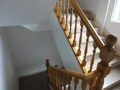 a staircase with wooden railings and a stair case at Pensión Monterredondo in Meira