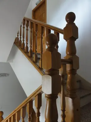 a staircase with wooden railings and a stair case at Pensión Monterredondo in Meira
