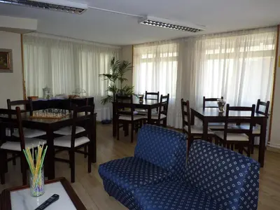 a dining room with a table and chairs and a table and chairsktop at Hotel España in Lugo