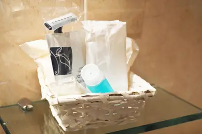 a basket filled with items on a glass table at Pensión Residencia Fornos in Santiago de Compostela