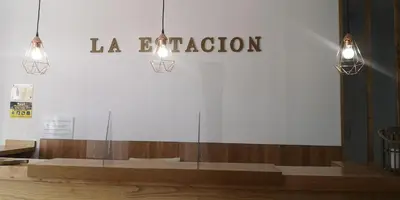 a bedroom with a bed with two towels on it at Pensión La Estación in Sarria