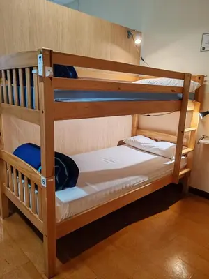 a couple of bunk beds in a room at Albergue A Ponte Ribadeo in Ribadeo