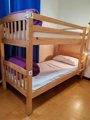 a couple of bunk beds in a room at Albergue A Ponte Ribadeo in Ribadeo