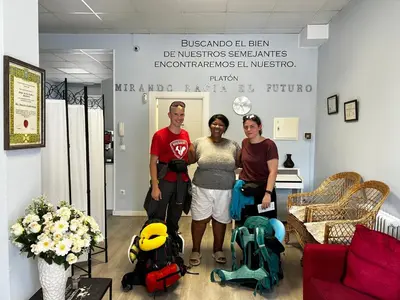 a group of three people standing in a room at La Rosa Azul Rooms-Grupo Rosa Azul in Ponferrada