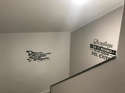 a room with some writing on the wall at La Rosa Azul Rooms-Grupo Rosa Azul in Ponferrada