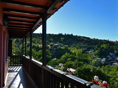 a balcony with a view of a mountain at O Palleiro do Pe do Forno in Orellán