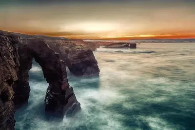 an image of an arch in the ocean at Apartamento Playa de Altar in Barreiros