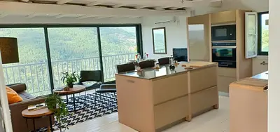 an office with a view of a living room at Casa da Viña - Ribeira Sacra in Nogueira de Ramuin