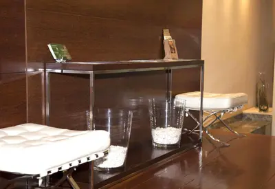 a room with two stools and a table with glasses at Hotel Compostela in Santiago de Compostela