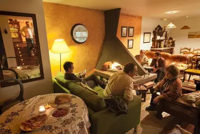 a group of people sitting in a living room at Hotel Rural La Peregrina in Carucedo