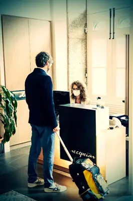 a man pulling a box with a woman in an office at Deniké Grupo Atalaia in Santiago de Compostela
