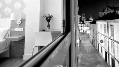 a view of a city street from a window at Deniké Grupo Atalaia in Santiago de Compostela