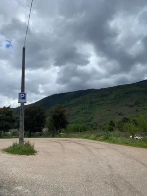 a pole with a sign on the side of a road at A lastra in Villamartín