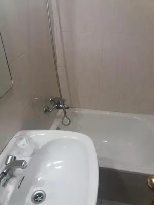 a bathroom with a white sink and a tub at Hotel Irixo in Ourense