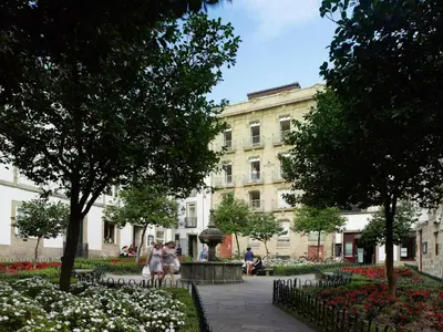 a group of people walking in front of a building at Hotel Montes in Santiago de Compostela