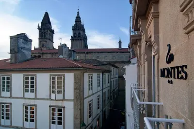 a view of a city with buildings and two towers at Hotel Montes in Santiago de Compostela