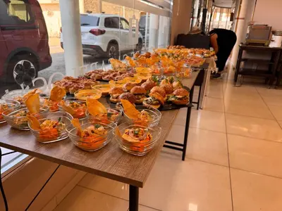 a long table filled with sandwiches and other food at Hotel Villa de Cacabelos in Cacabelos