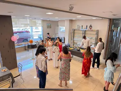 a group of people standing around in a room at Hotel Villa de Cacabelos in Cacabelos