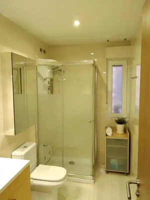 a bathroom with a glass shower and a toilet at Mirador de la Ría in Ribadeo