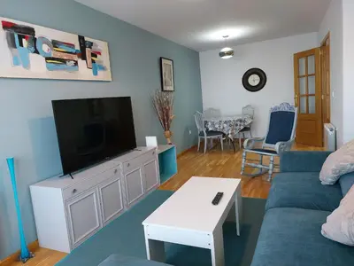 a living room with a couch and a tv at El Silencio de Galadhrim in Ponferrada