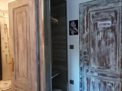 a wooden door in a room with a closet at La Casona de Betanzos in Betanzos