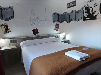 a bedroom with a bed with a towel on it at La Casona de Betanzos in Betanzos