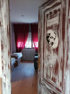 a room with a door with a sticker on it at La Casona de Betanzos in Betanzos