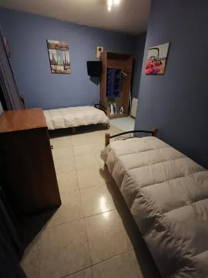 a room with two beds in a room with at Casa Foz in Foz