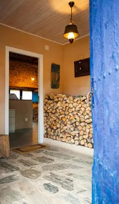 a room with a wall of fire wood at CASA COLOMBA in Santa Colomba de Somoza