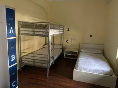 a bedroom with two bunk beds in a room at El cordal de laciana in Caboalles de Abajo