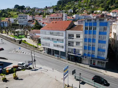 an aerial view of a city street with buildings at Hotel Eumesa in Puentedeume
