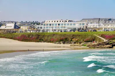 a view of a beach with buildings in the background at Playa de Foz Hotel & Spa by gaiarooms in Foz
