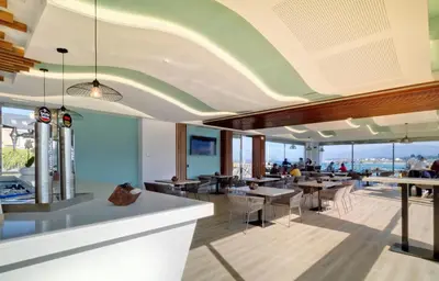 a restaurant with a view of the ocean at Playa de Foz Hotel & Spa by gaiarooms in Foz