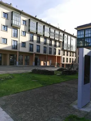 a large white building with a lot of windows at Apartamento Plaza de España in Ribadeo