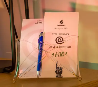 a winning envelope with a pen on a table at HOTEL JAVIER MONTERO in Ribadeo