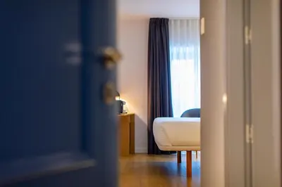 a hotel room with a bed and a window at HOTEL JAVIER MONTERO in Ribadeo
