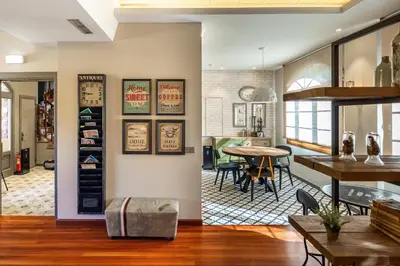 a living room with a table and a dining room at Hotel Casa Miño in Pola de Somiedo