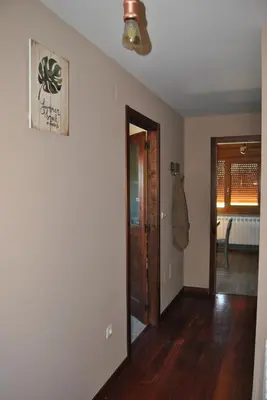 an empty room with a door and a hallway at Casa Loisiana in O Pino