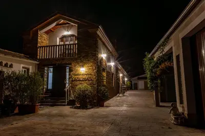 an empty alley with a building at night at Apartamentos lagunas in Castropol