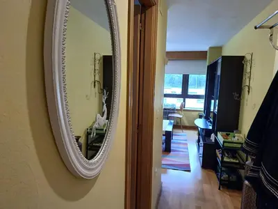 a mirror hanging on a wall in a room at María Belkis ll in Ourense